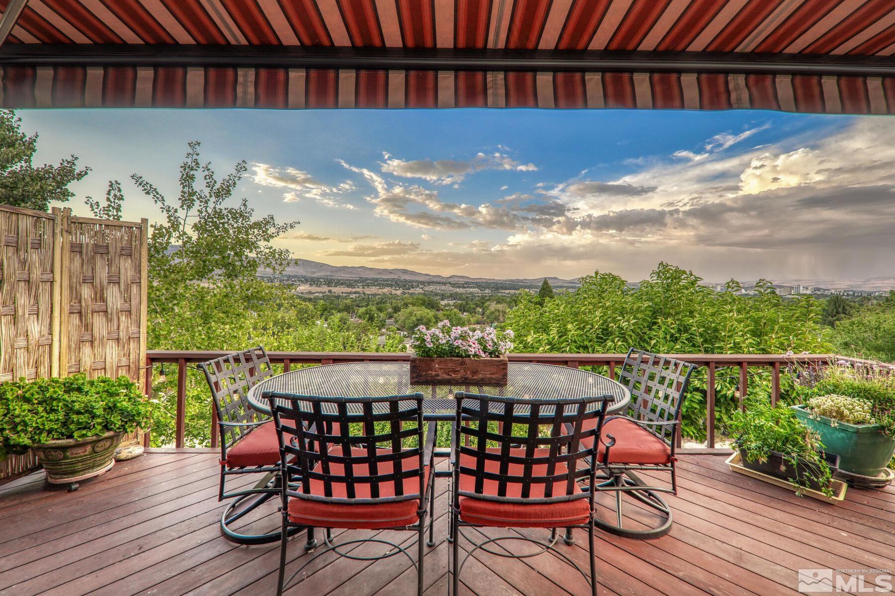2025 Heatheridge Lane Reno, NV 89509 - Photo 13 of 40 a view of a chairs and table on the wooden roof deck