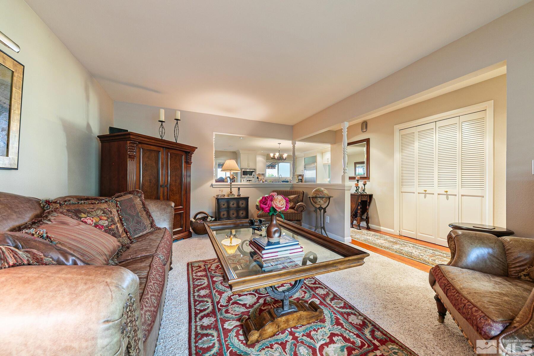 2025 Heatheridge Lane Reno, NV 89509 - Photo 20 of 40 a living room with furniture a rug and a window