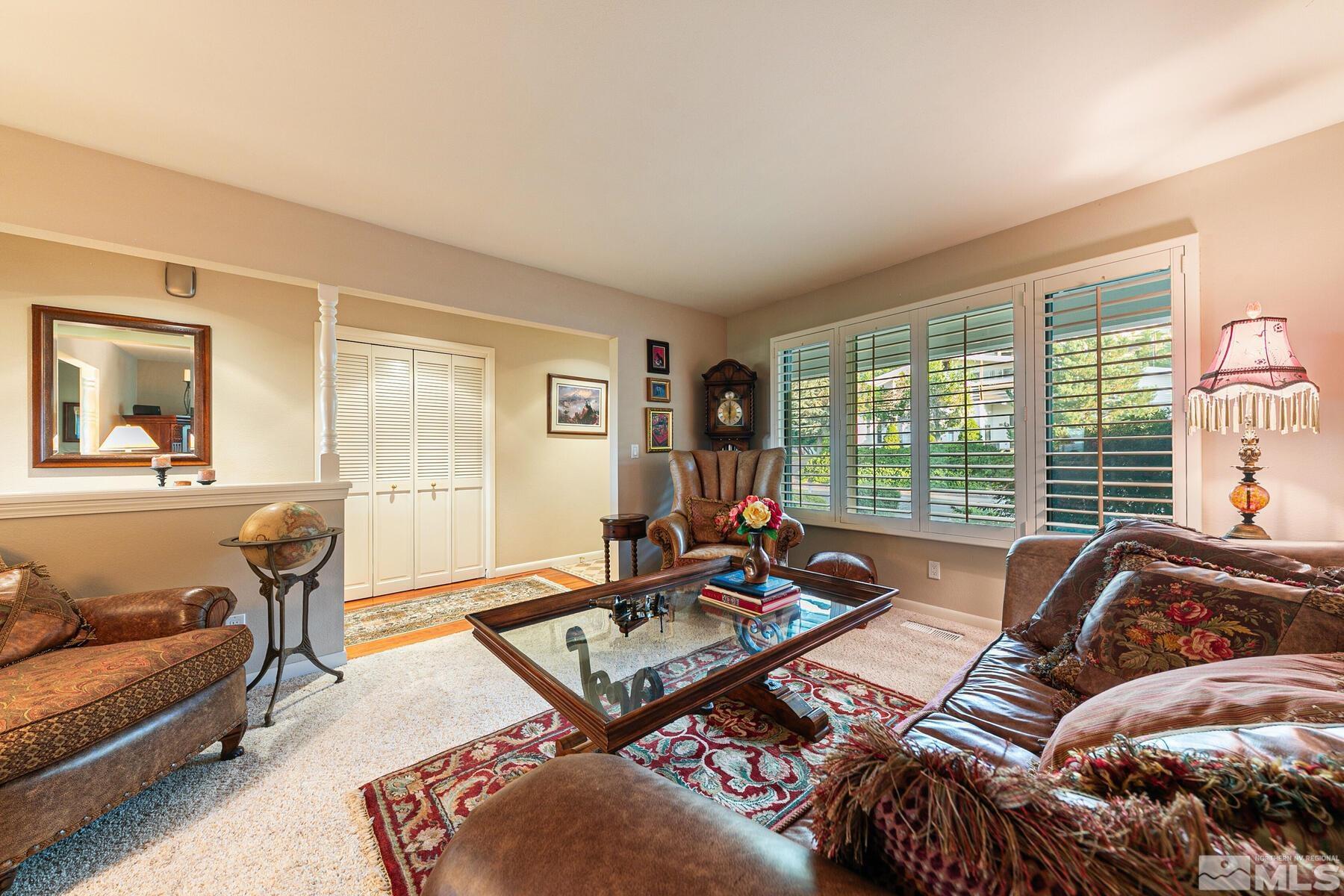 2025 Heatheridge Lane Reno, NV 89509 - Photo 21 of 40 a living room with furniture and a large window