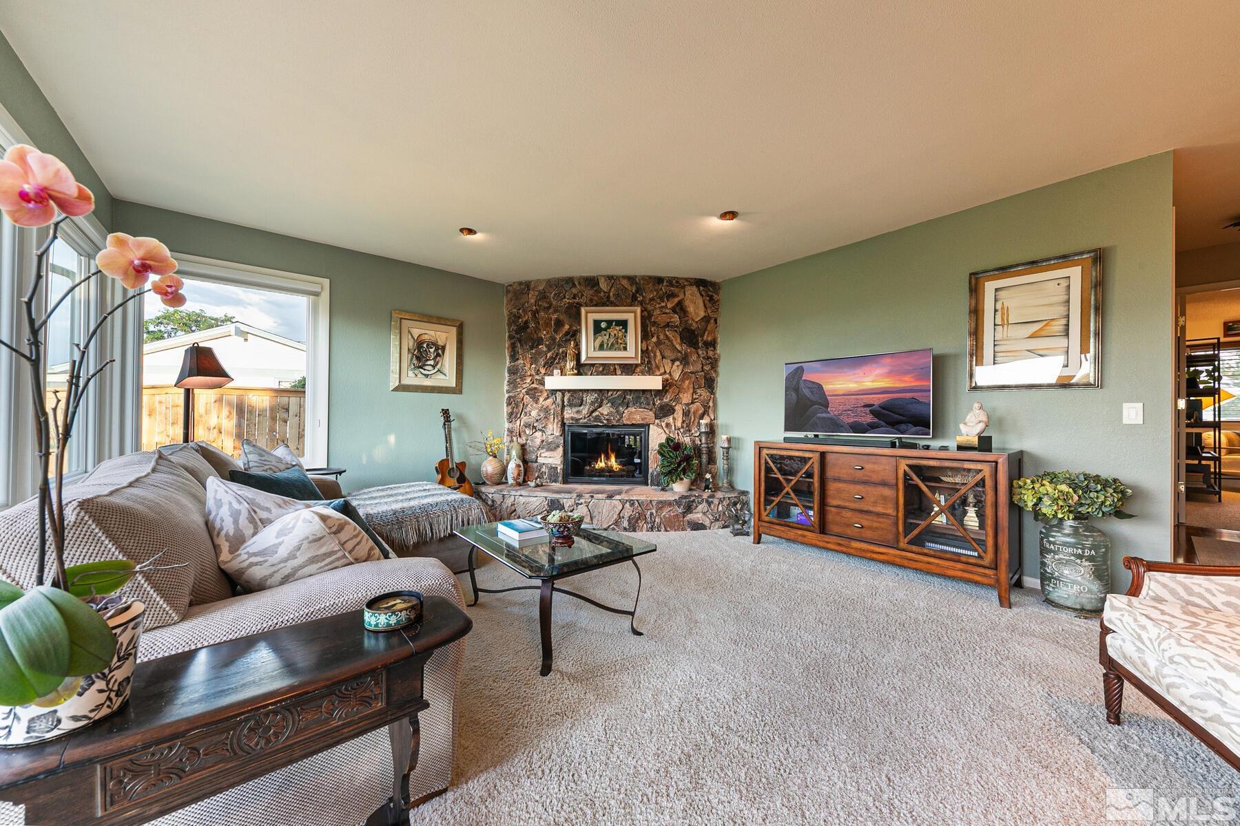 2025 Heatheridge Lane Reno, NV 89509 - Photo 29 of 40 a living room with furniture and a flat screen tv