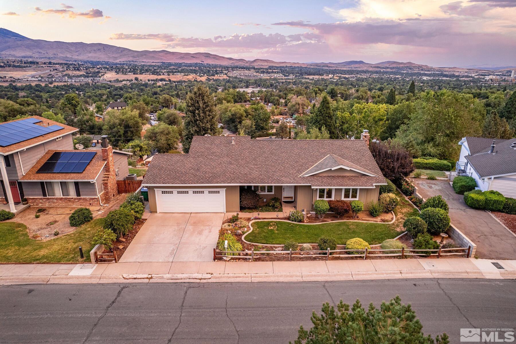 2025 Heatheridge Lane Reno, NV 89509 - Photo 3 of 40 an aerial view of residential houses and street