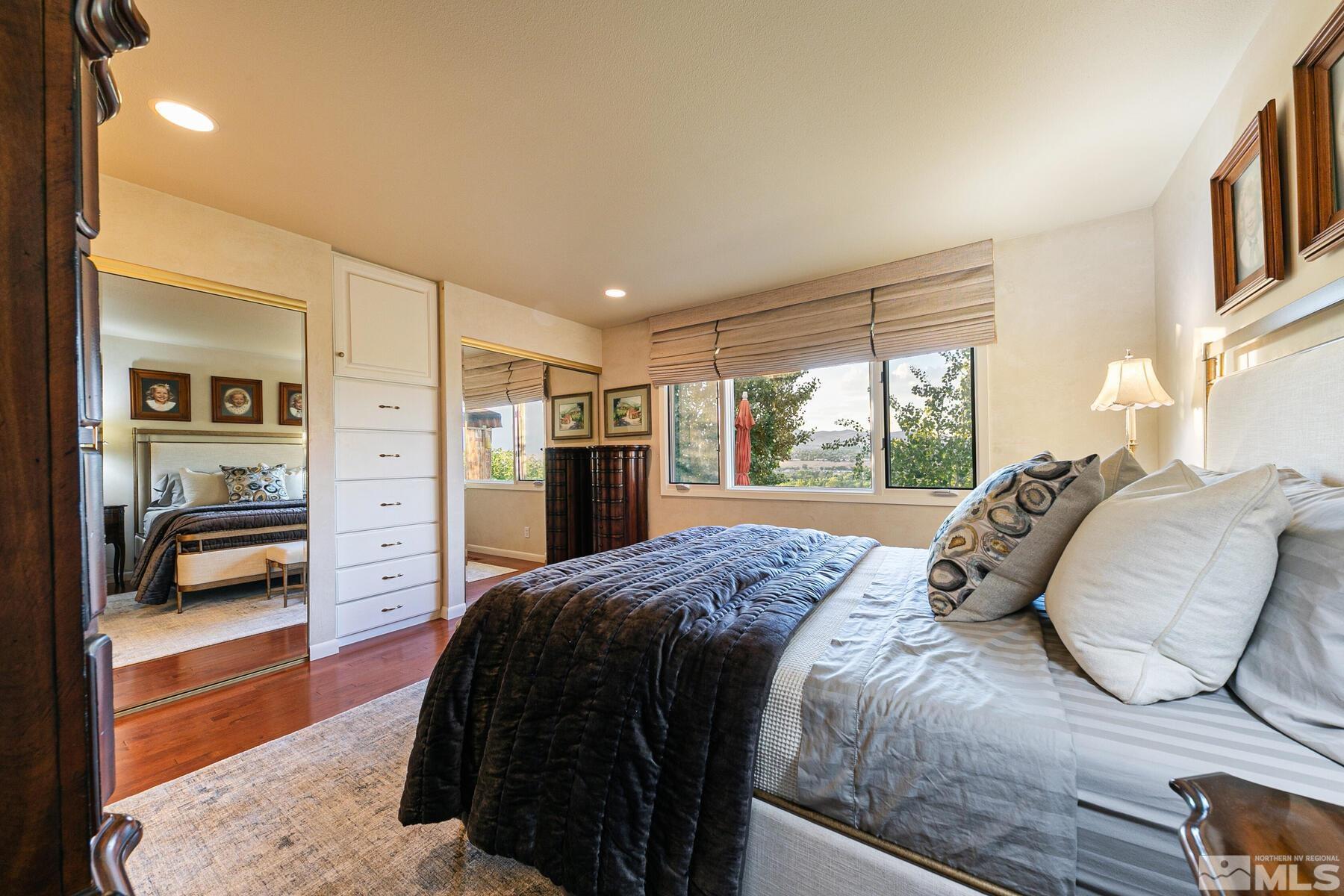 2025 Heatheridge Lane Reno, NV 89509 - Photo 32 of 40 a bedroom with a large bed and a large window