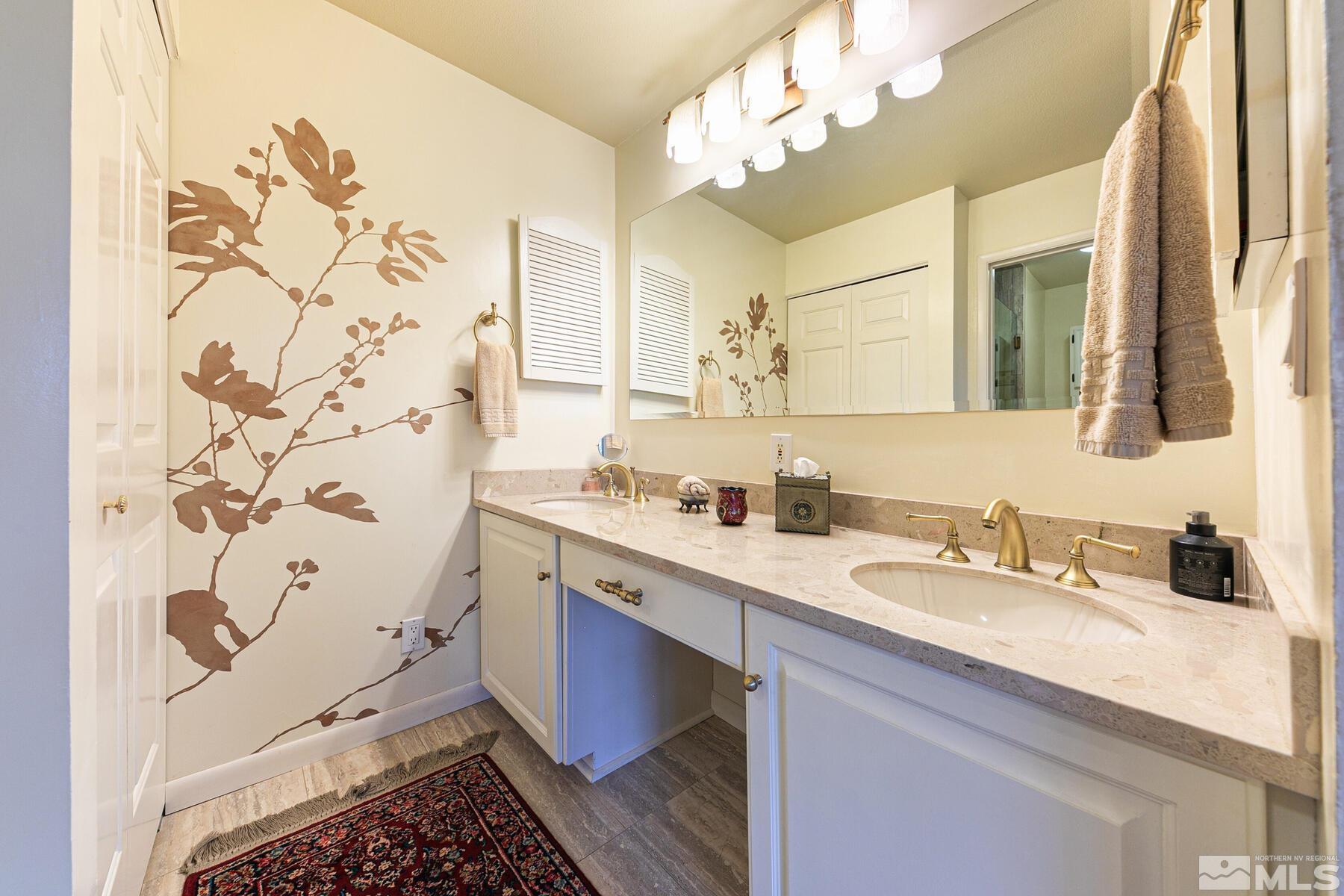 2025 Heatheridge Lane Reno, NV 89509 - Photo 35 of 40 a bathroom with a double vanity sink mirror and double