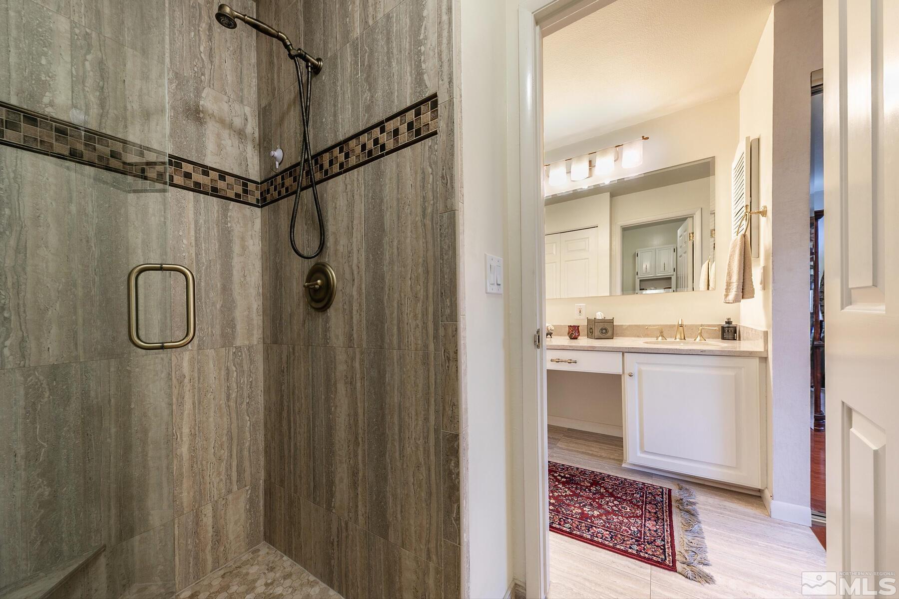 2025 Heatheridge Lane Reno, NV 89509 - Photo 36 of 40 a bathroom with a sink and a mirror