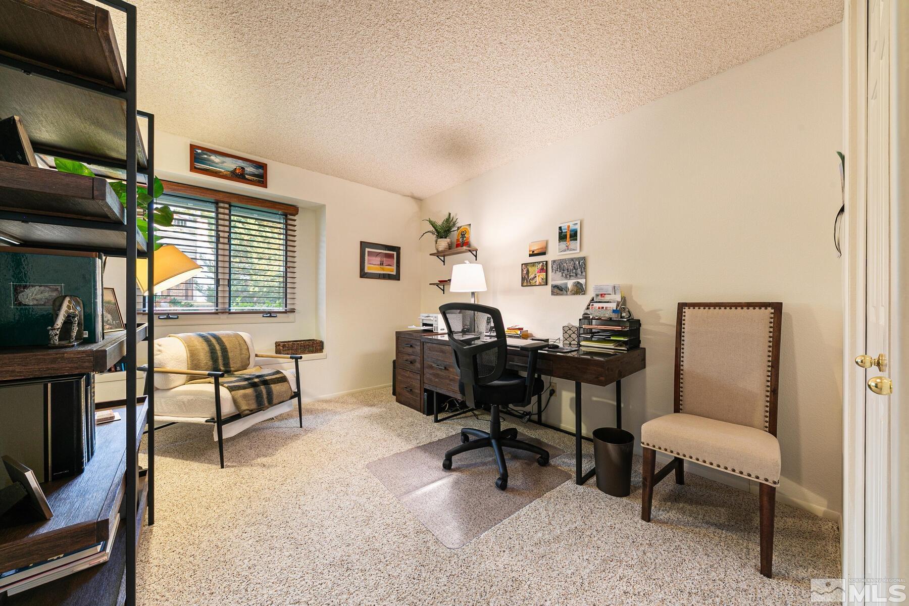 2025 Heatheridge Lane Reno, NV 89509 - Photo 37 of 40 a view of a livingroom with workspace and a couch