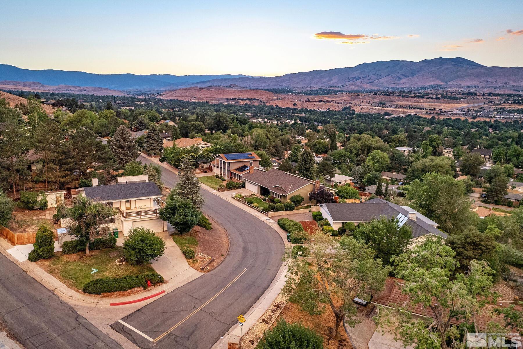 2025 Heatheridge Lane Reno, NV 89509 - Photo 5 of 40 a view of a city with mountains in the background