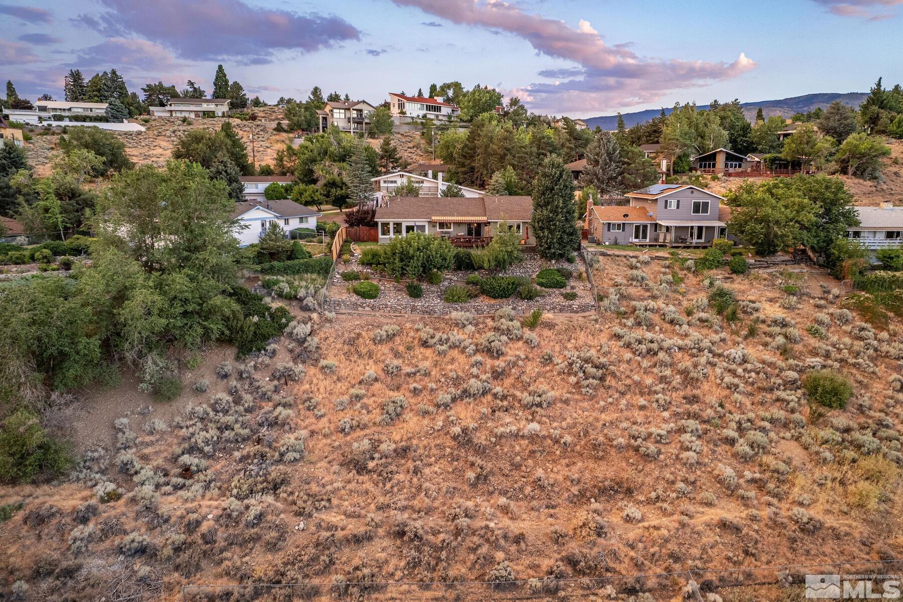 2025 Heatheridge Lane Reno, NV 89509 - Photo 7 of 40 a view of a houses with a yard and front a house