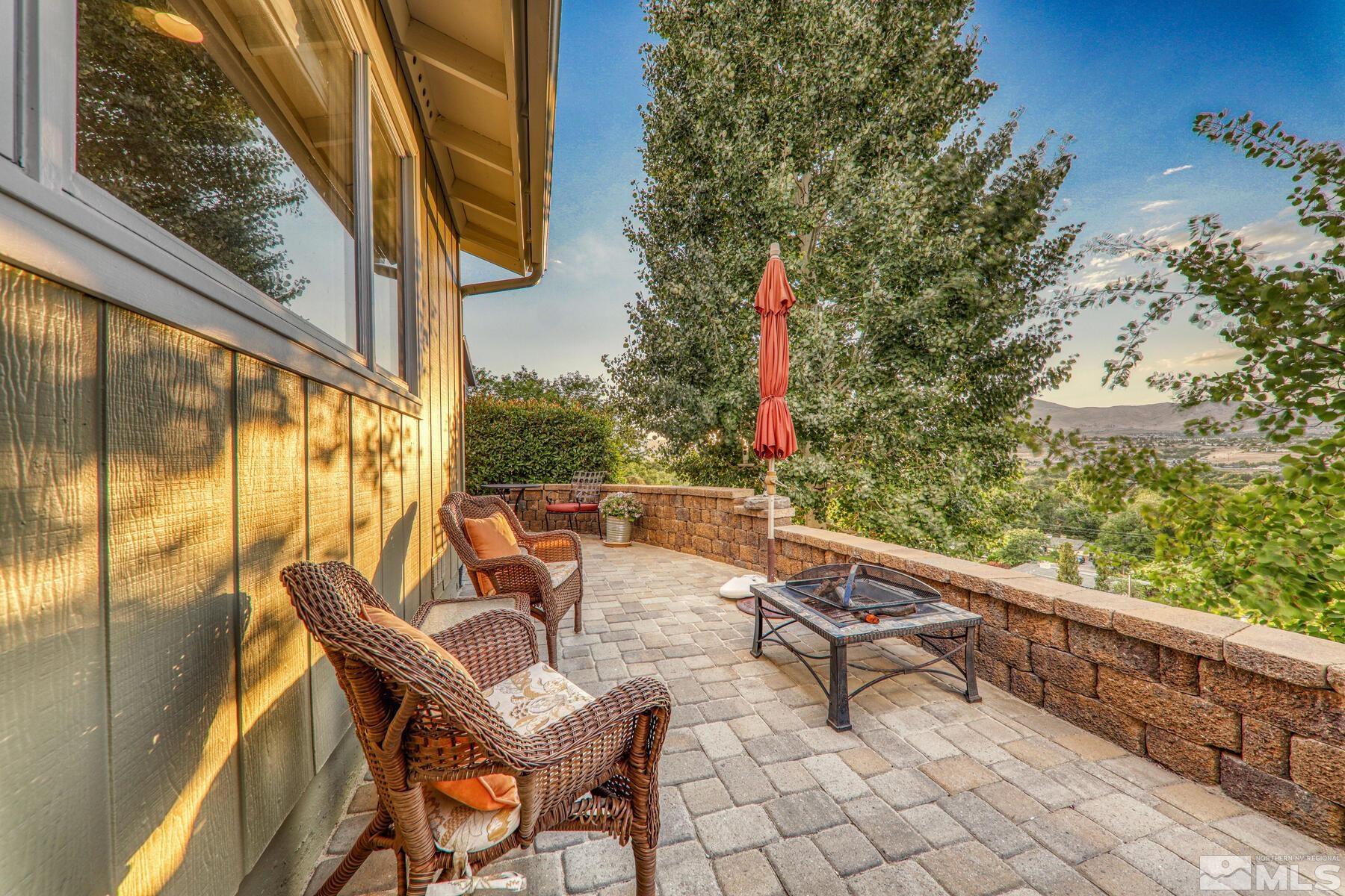 2025 Heatheridge Lane Reno, NV 89509 - Photo 9 of 40 a balcony with wooden floor and outdoor seating