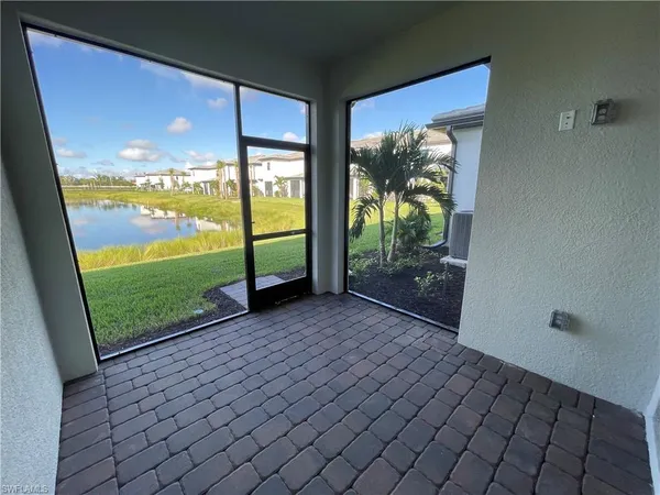 a view of a lake with houses in the back