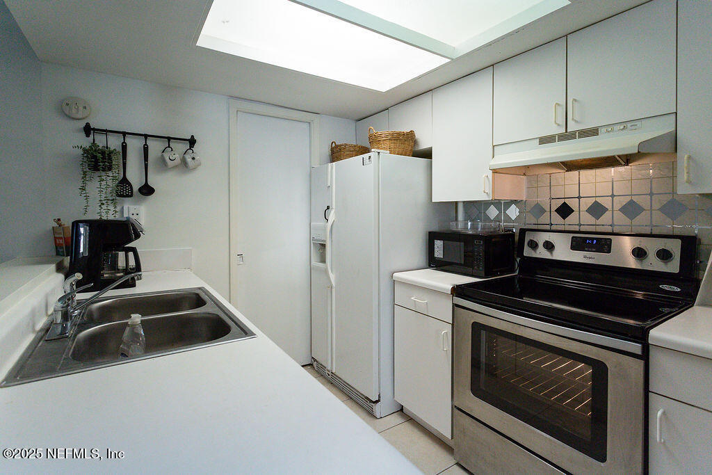 5328 Arlington Road Jacksonville, FL 32211 - Photo 9 of 16 a kitchen that has a sink and a stove