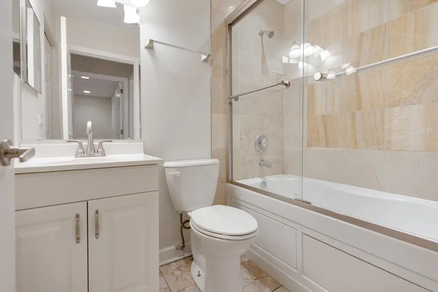 a bathroom with a sink a toilet and a bathtub