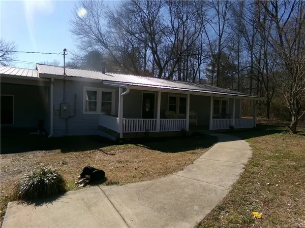 a view of house with yard