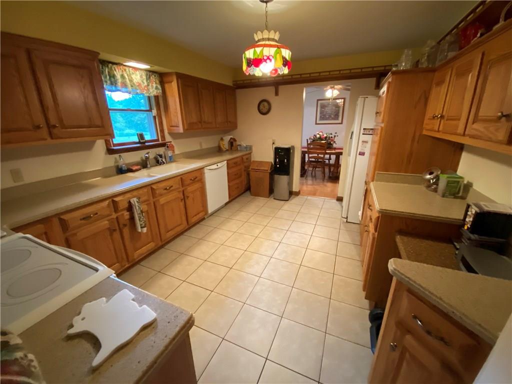 97 Gibson Road Greenville, PA 16125 - Photo 9 of 23 Oak kitchen with tile floor/appliance package, pull out drawers.