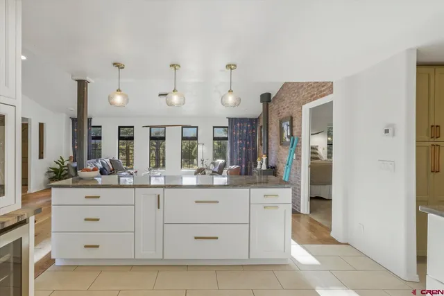 a kitchen with cabinets and window