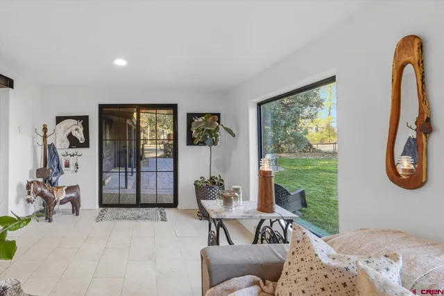 a bedroom with furniture and a window