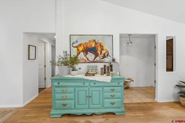 a view of room with window and wooden floor