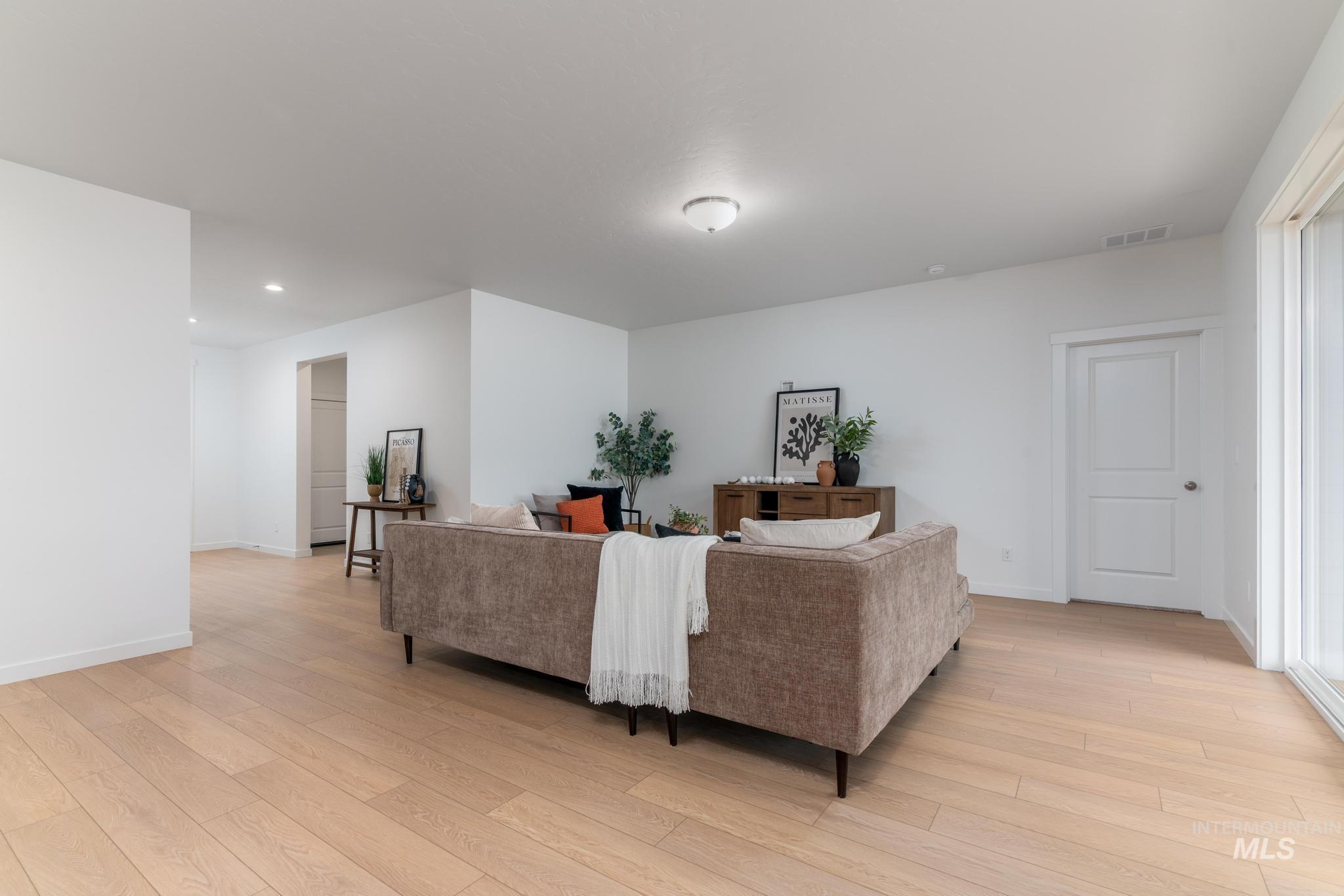 6285 West Snow Currant Street Meridian, ID 83646 - Photo 2 of 10 Living area featuring light wood-style flooring and recessed lighting