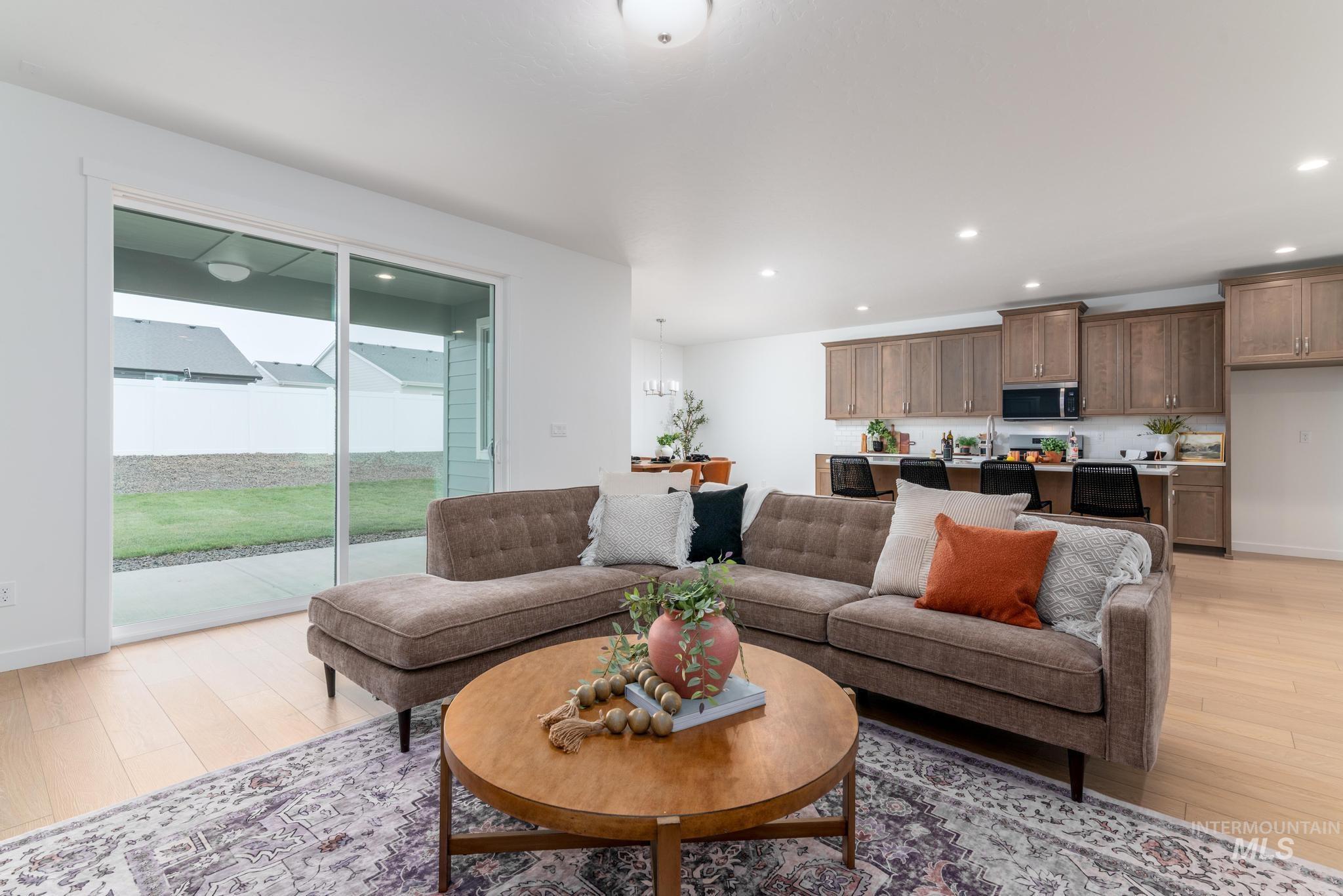 6285 West Snow Currant Street Meridian, ID 83646 - Photo 3 of 10 Living room with light wood finished floors and recessed lighting