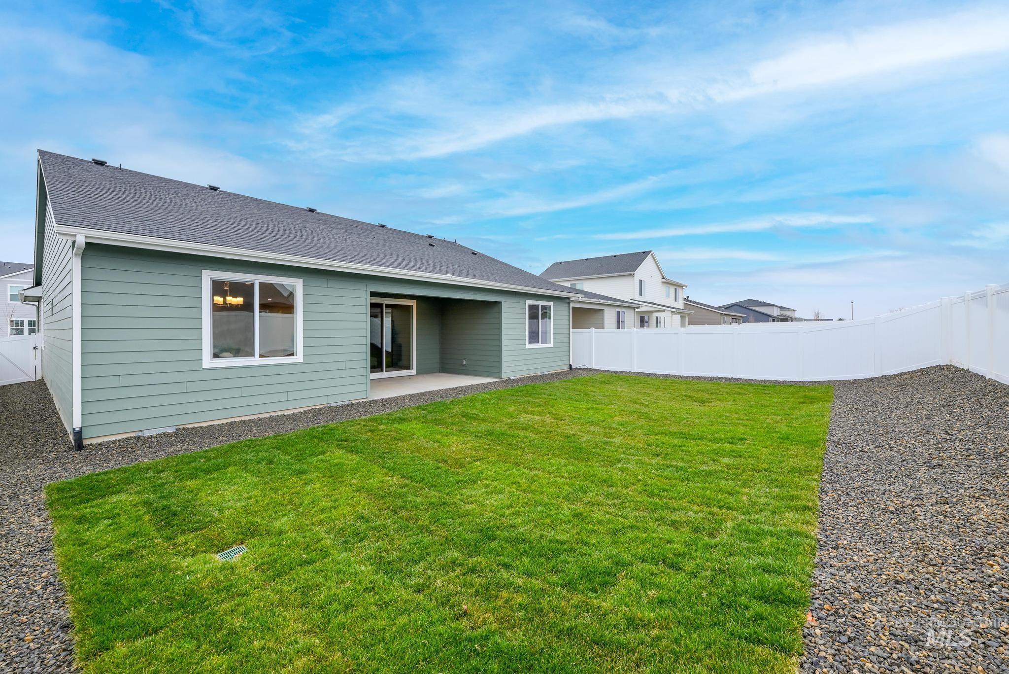 6285 West Snow Currant Street Meridian, ID 83646 - Photo 10 of 10 Rear view of house with a patio, a fenced backyard, and roof with shingles