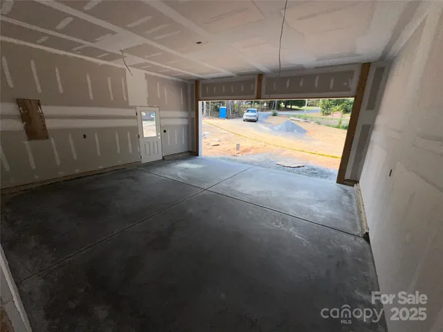 a view of a kitchen with refrigerator and a dishwasher
