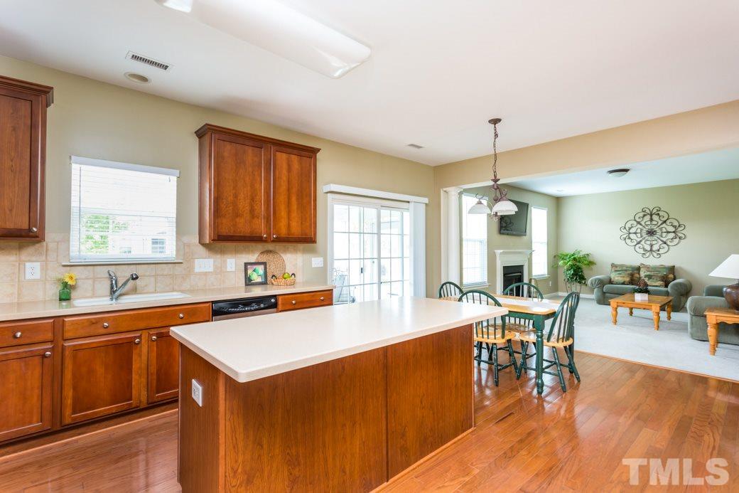 5332 Glass Ridge Road Raleigh, NC 27616 - Photo 3 of 18 a kitchen with a sink a counter top space and stainless steel appliances