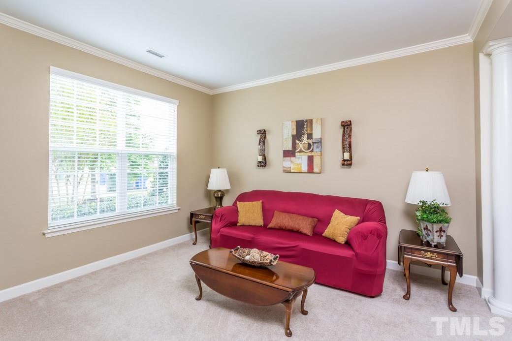 5332 Glass Ridge Road Raleigh, NC 27616 - Photo 7 of 18 a living room with furniture and a window