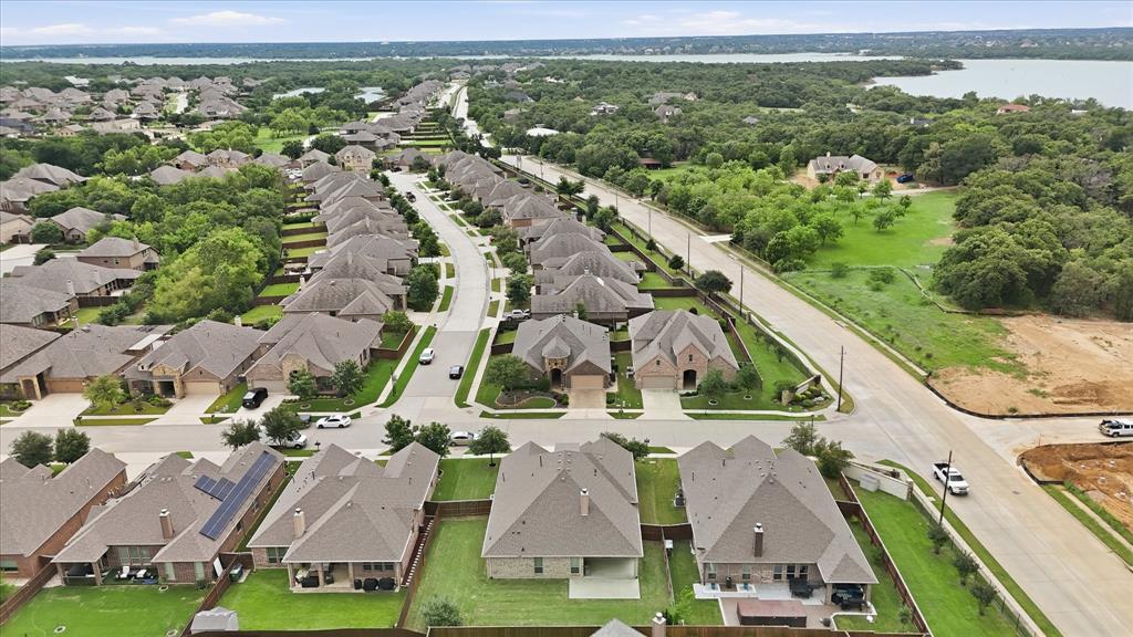 215 Equestrian Road Hickory Creek, TX 75065 - Photo 35 of 36 an aerial view of residential houses with outdoor space and swimming pool
