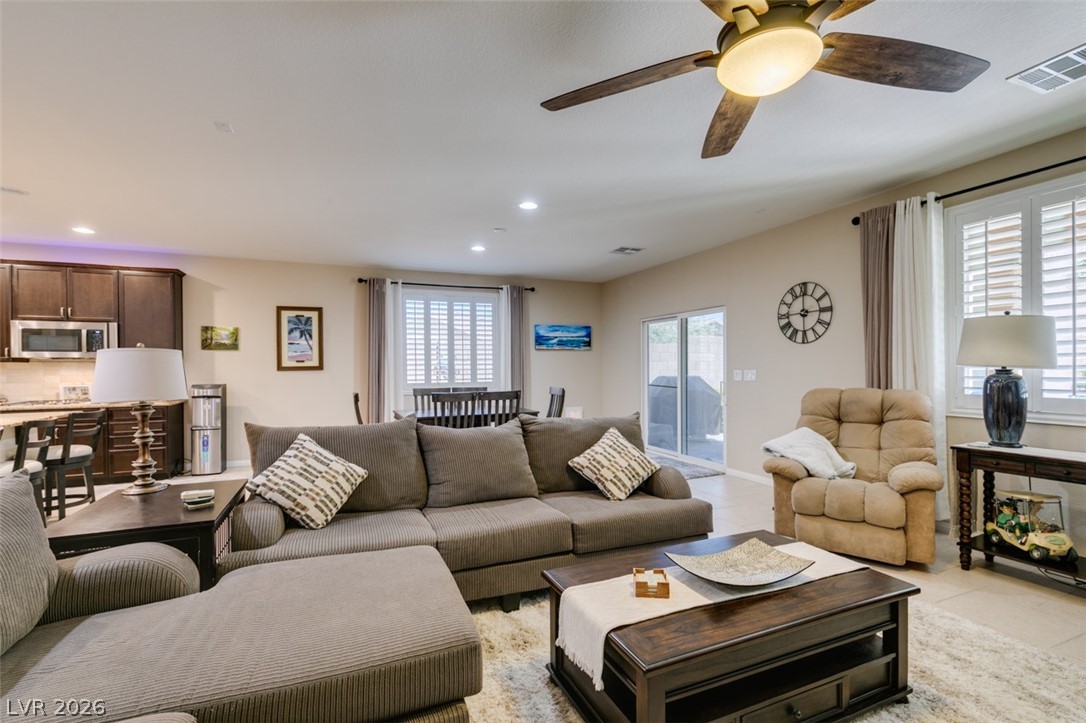 7375 Campbell Ranch Avenue Las Vegas, NV 89179 - Photo 45 of 45 A great room offering an open floor plan with a comfortable seating area and kitchen access.