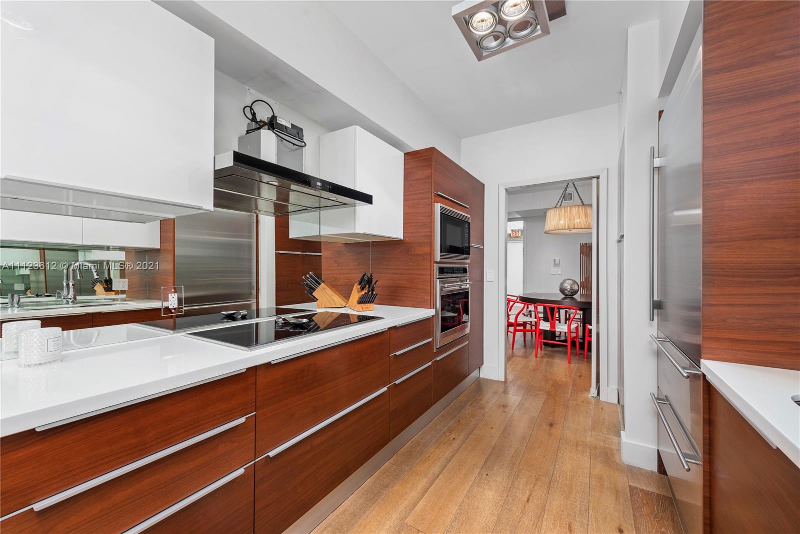 739 Crandon Boulevard, Unit PH1 Key Biscayne, FL 33149 - Photo 12 of 33 a very nice looking room with a large window