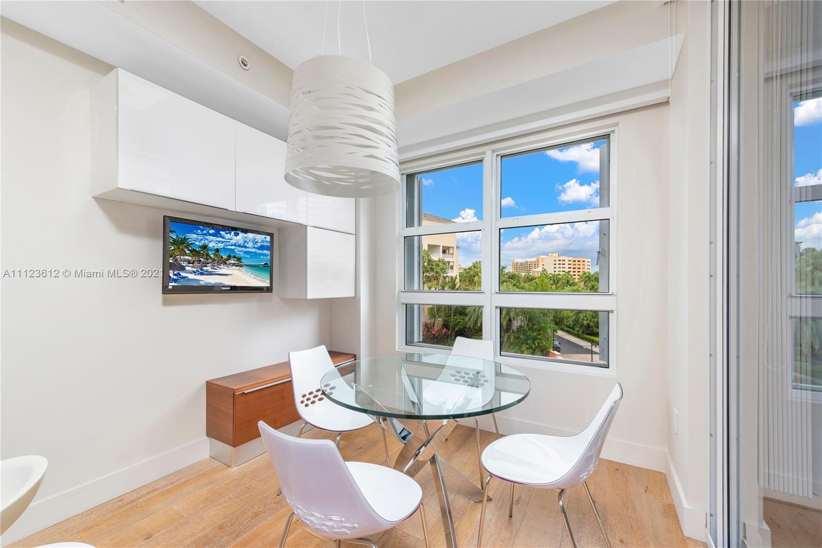 739 Crandon Boulevard, Unit PH1 Key Biscayne, FL 33149 - Photo 15 of 33 a view of a dining room with furniture window and outside view