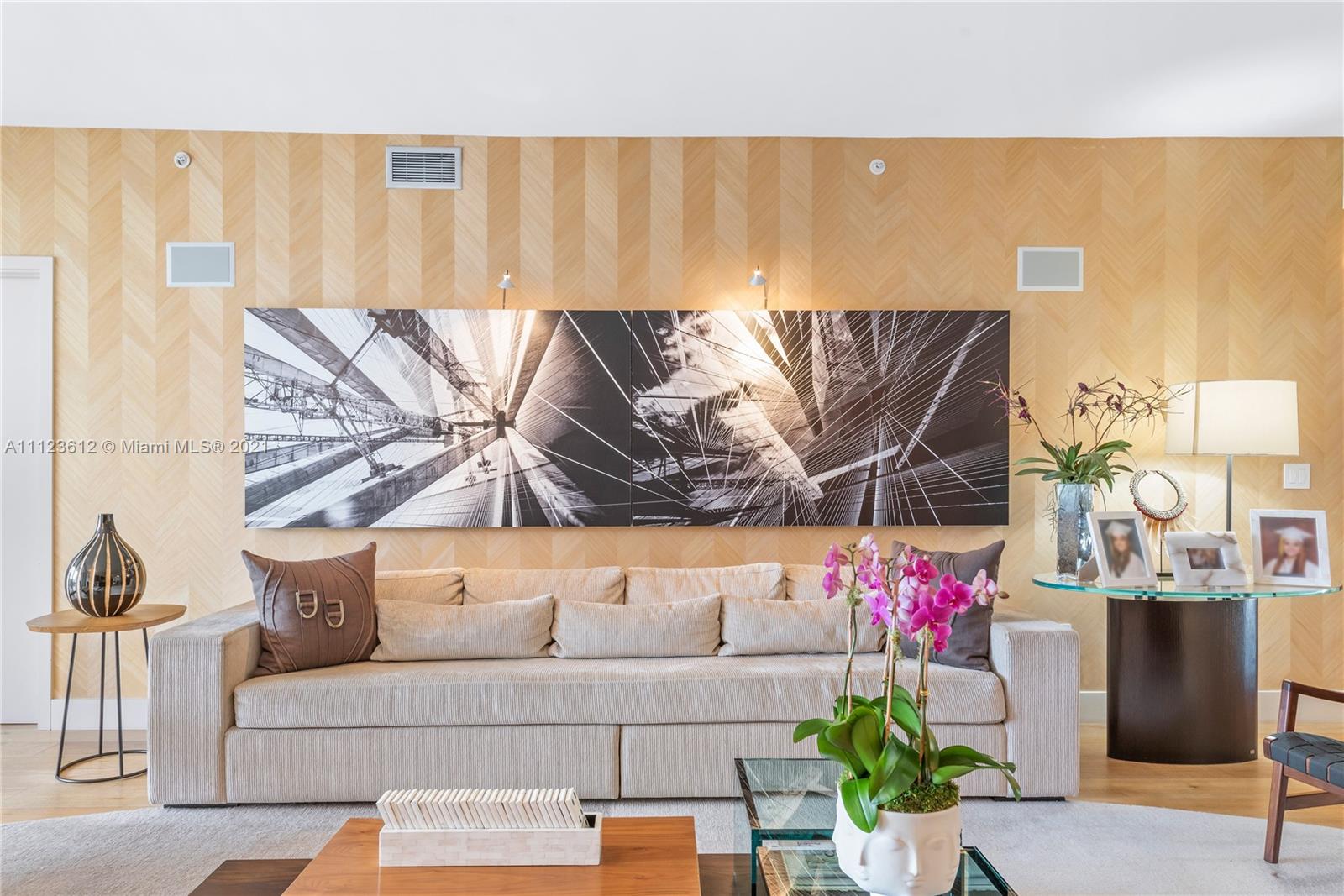 739 Crandon Boulevard, Unit PH1 Key Biscayne, FL 33149 - Photo 3 of 33 a living room with furniture and flowers