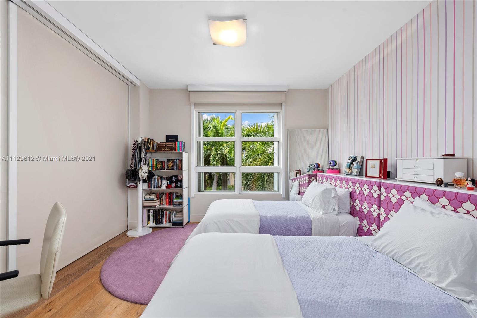 739 Crandon Boulevard, Unit PH1 Key Biscayne, FL 33149 - Photo 24 of 33 a bedroom with furniture and a window