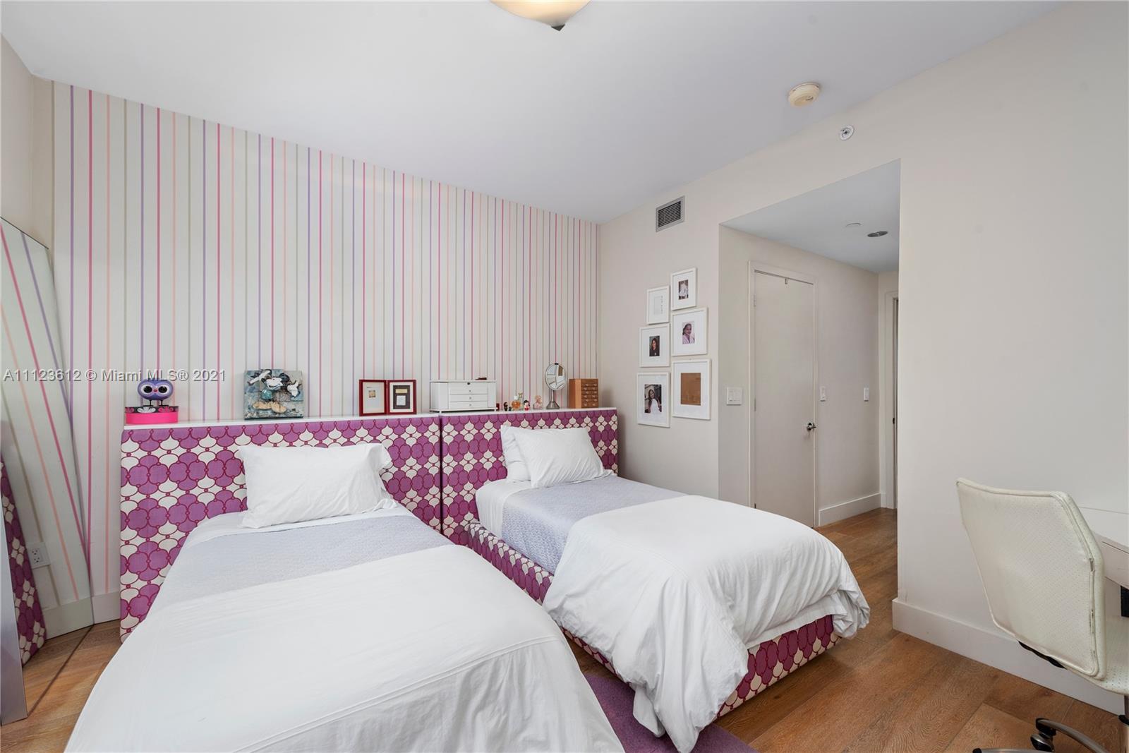 739 Crandon Boulevard, Unit PH1 Key Biscayne, FL 33149 - Photo 25 of 33 a bedroom with a white bed and curtain