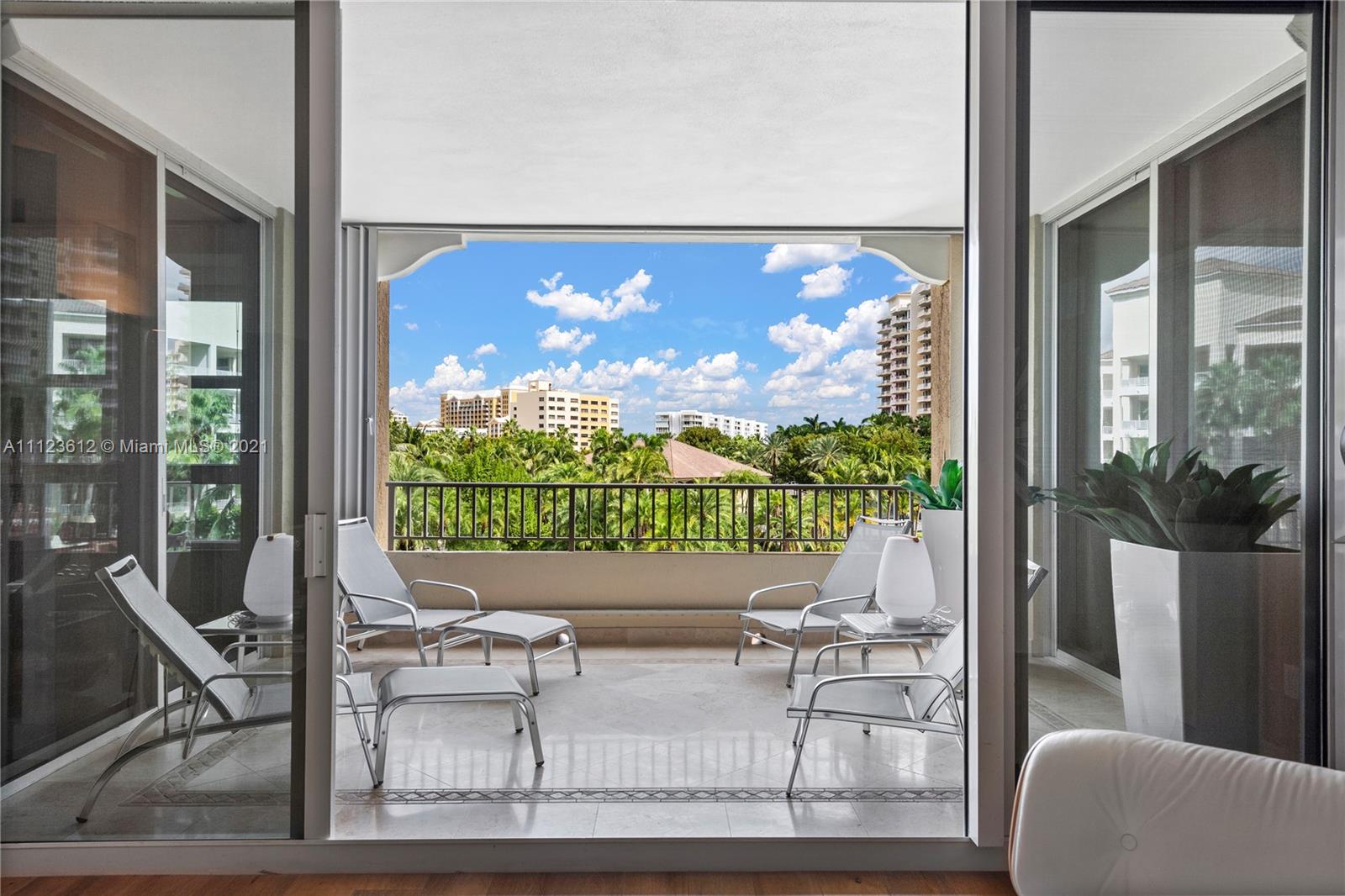739 Crandon Boulevard, Unit PH1 Key Biscayne, FL 33149 - Photo 28 of 33 a view of a door with a couches and table in balcony