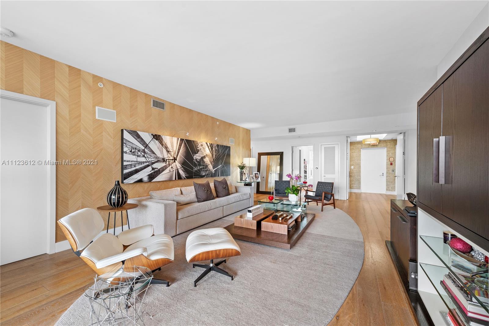 739 Crandon Boulevard, Unit PH1 Key Biscayne, FL 33149 - Photo 5 of 33 a living room with furniture and wooden floor