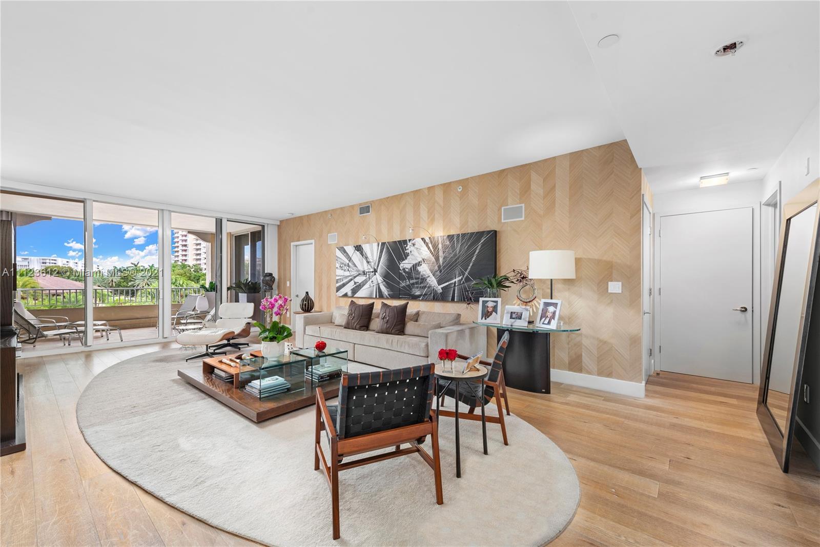 739 Crandon Boulevard, Unit PH1 Key Biscayne, FL 33149 - Photo 7 of 33 a outdoor space with furniture and a grill