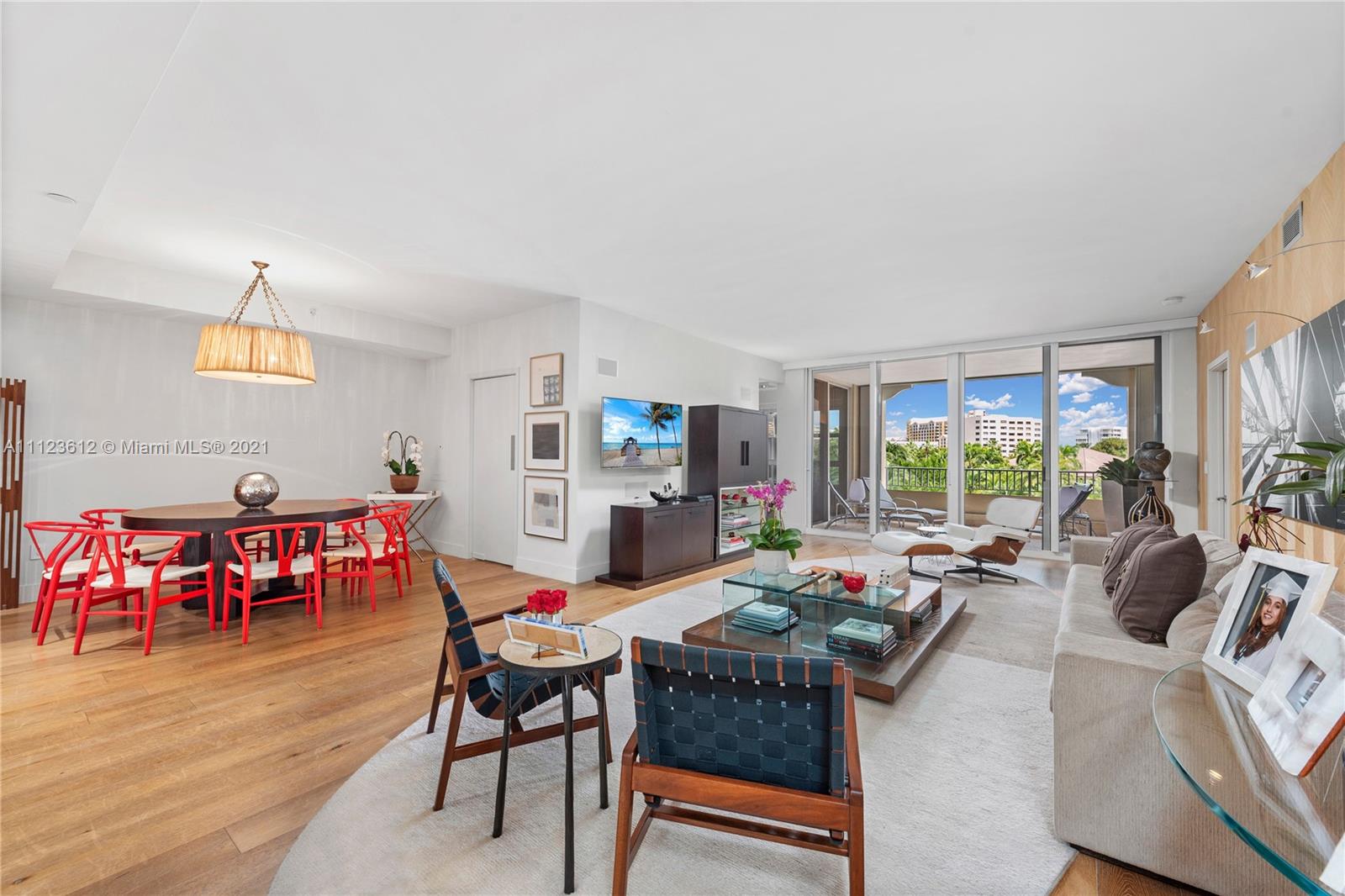 739 Crandon Boulevard, Unit PH1 Key Biscayne, FL 33149 - Photo 9 of 33 a living room with furniture a rug and a large window