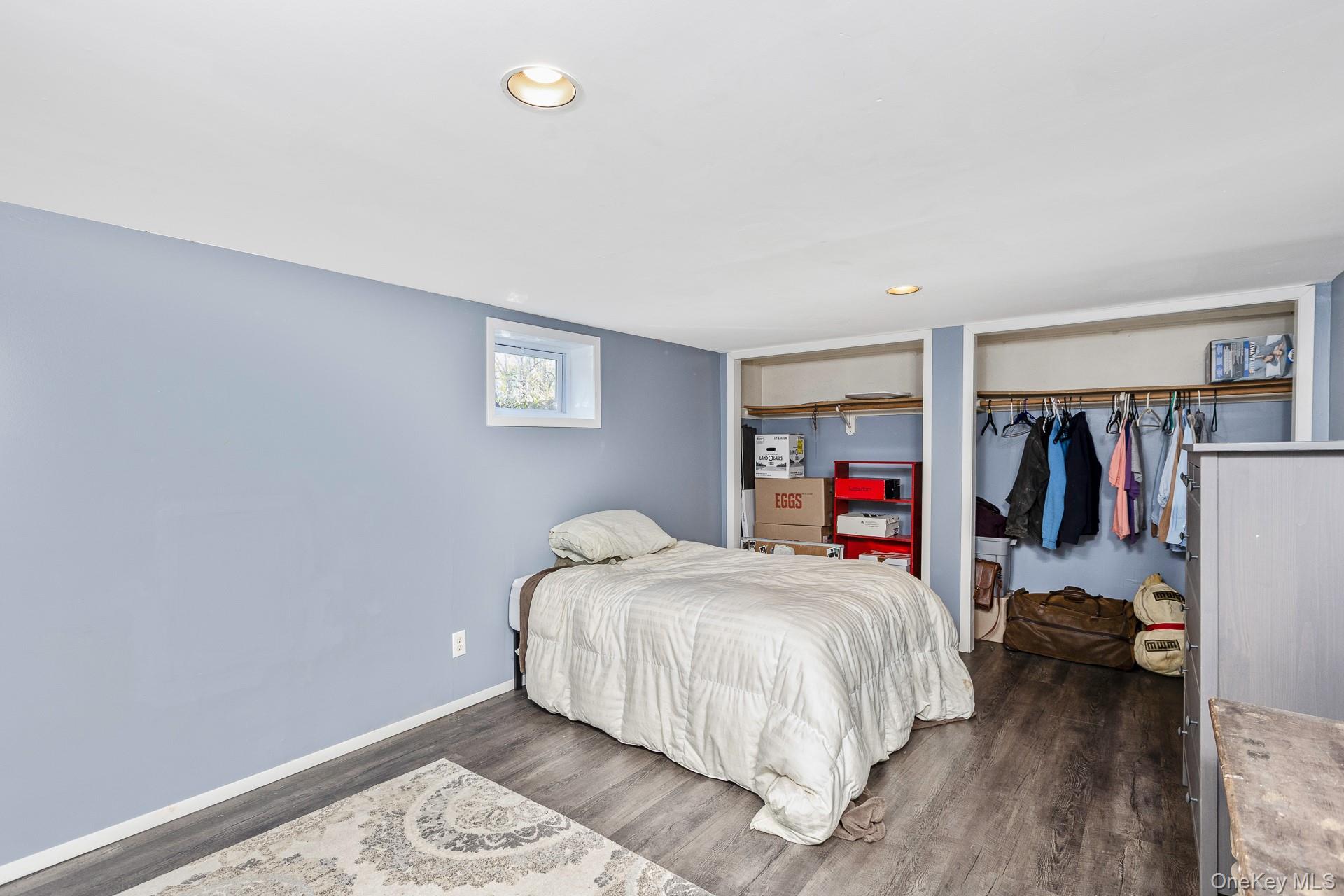 12 Applegate Drive Mastic, NY 11950 - Photo 19 of 29 Bedroom featuring wood finished floors, a closet, and recessed lighting