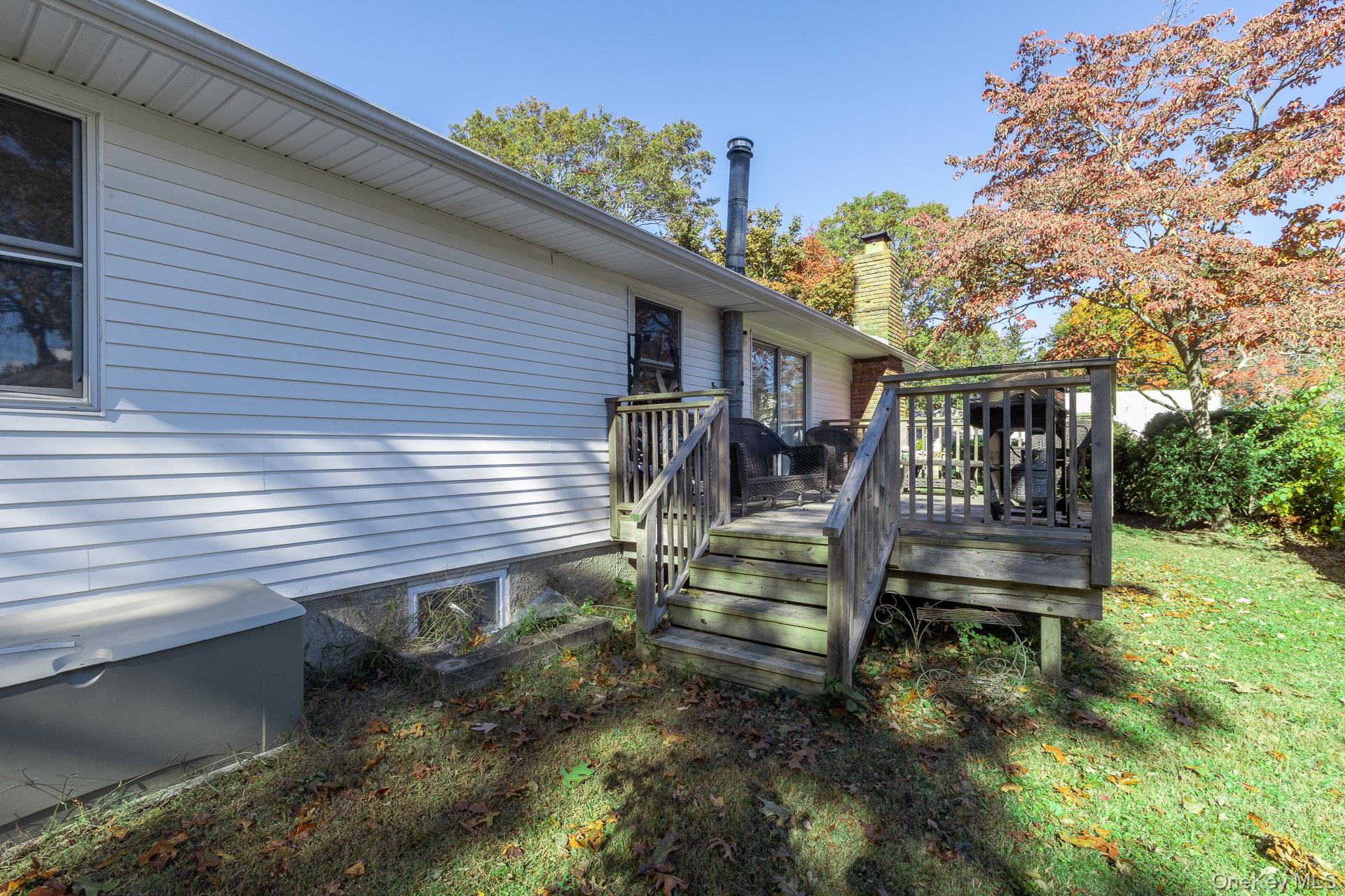 12 Applegate Drive Mastic, NY 11950 - Photo 24 of 29 View of wooden deck