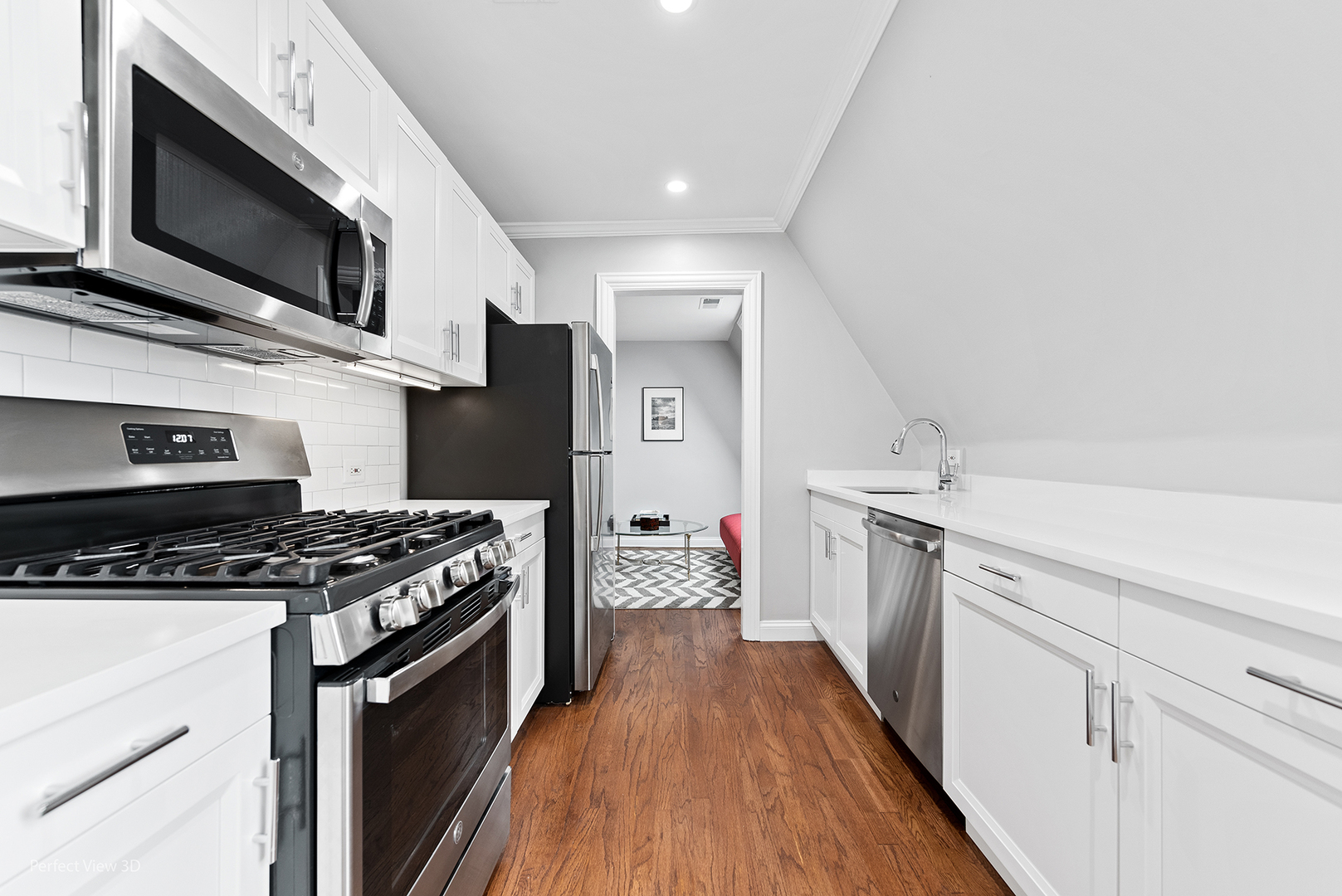 4938 South Drexel Boulevard, Unit 310 Chicago, IL 60615 - Photo 9 of 20 a kitchen with stainless steel appliances a stove a sink and a microwave