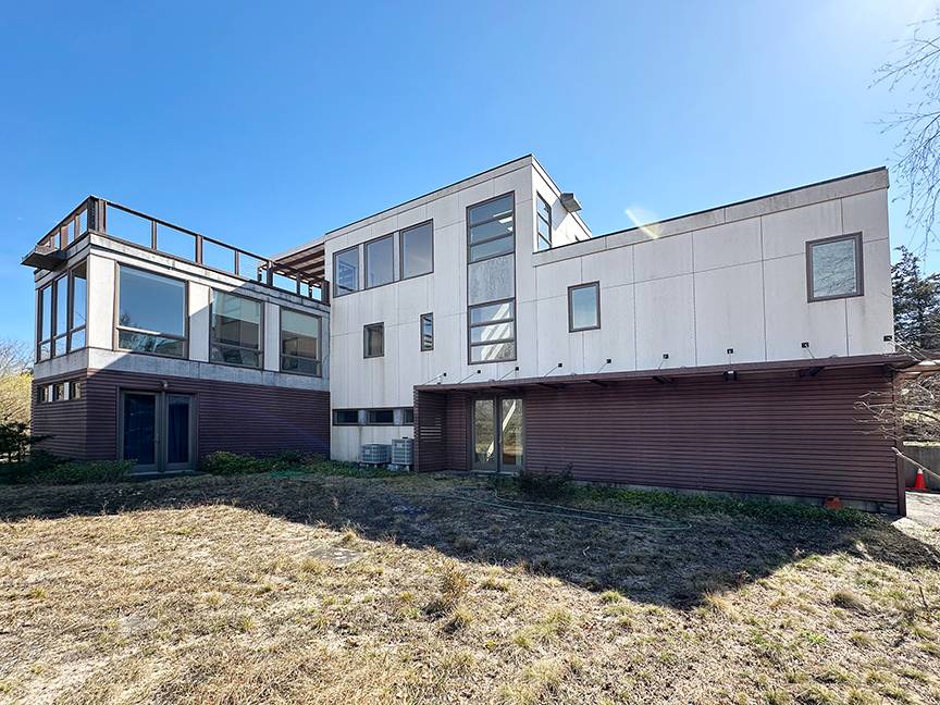 Undisclosed Address Water Mill, NY 11976 - Photo 2 of 12 a view of a white house with a yard