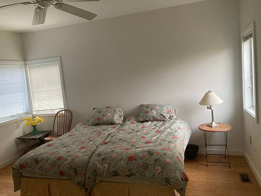 Undisclosed Address Water Mill, NY 11976 - Photo 7 of 12 a bedroom with two bed and a lamp