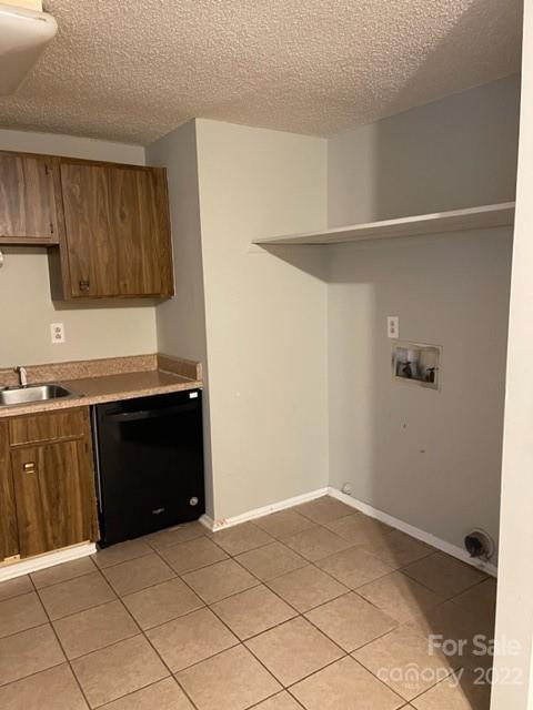 8129 Holly Hill Road Charlotte, NC 28227 - Photo 4 of 12 a kitchen with a cabinets and a refrigerator
