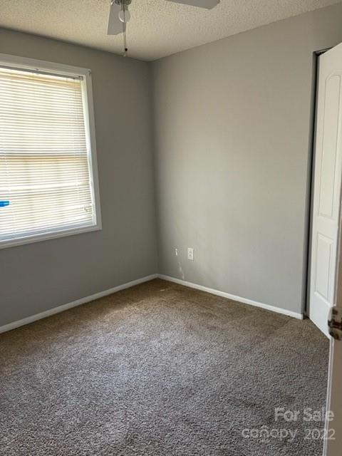 8129 Holly Hill Road Charlotte, NC 28227 - Photo 6 of 12 an empty room with a window