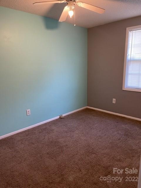 8129 Holly Hill Road Charlotte, NC 28227 - Photo 7 of 12 an empty room with windows