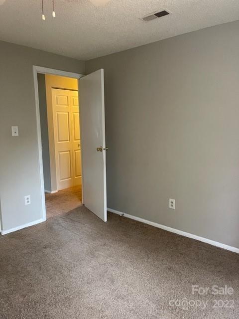 8129 Holly Hill Road Charlotte, NC 28227 - Photo 8 of 12 an empty room with window