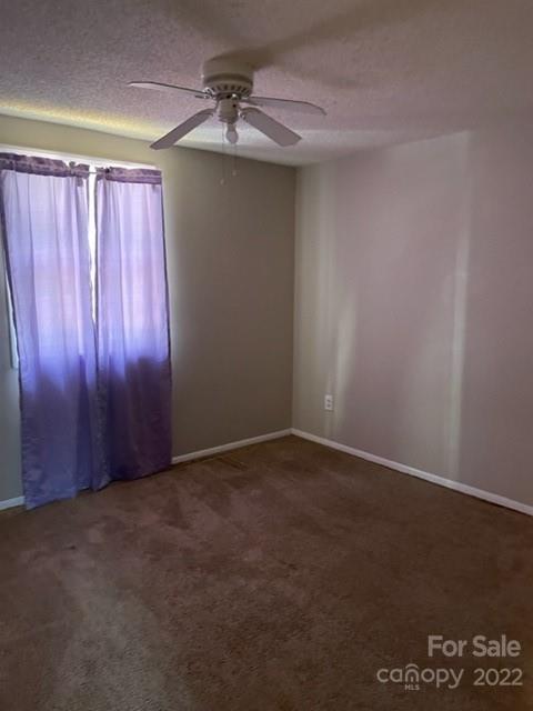 8129 Holly Hill Road Charlotte, NC 28227 - Photo 9 of 12 a view of an empty room and window