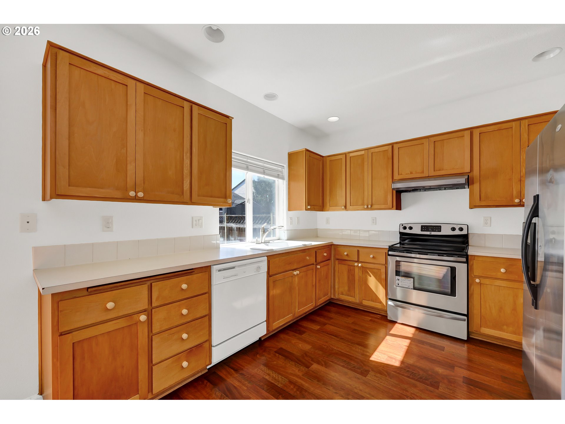 3906 Century Drive Eugene, OR 97402 - Photo 12 of 33 a kitchen with granite countertop cabinets stainless steel appliances and a sink