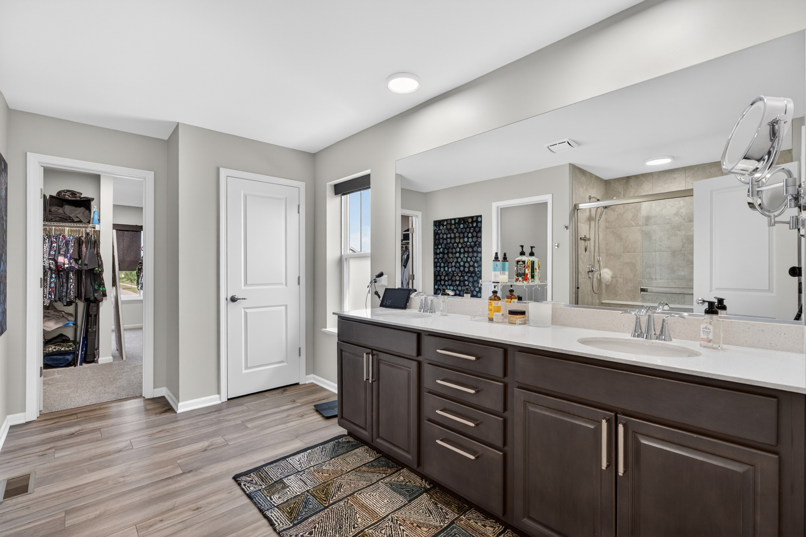 16230 Lake View Road Plainfield, IL 60586 - Photo 37 of 62 a bathroom with a double vanity sink and a mirror