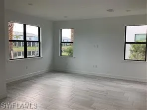 an empty room with windows